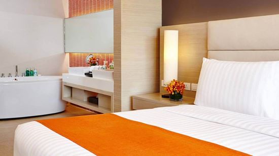 King bed in Corner Suite Ocean Front Balcony